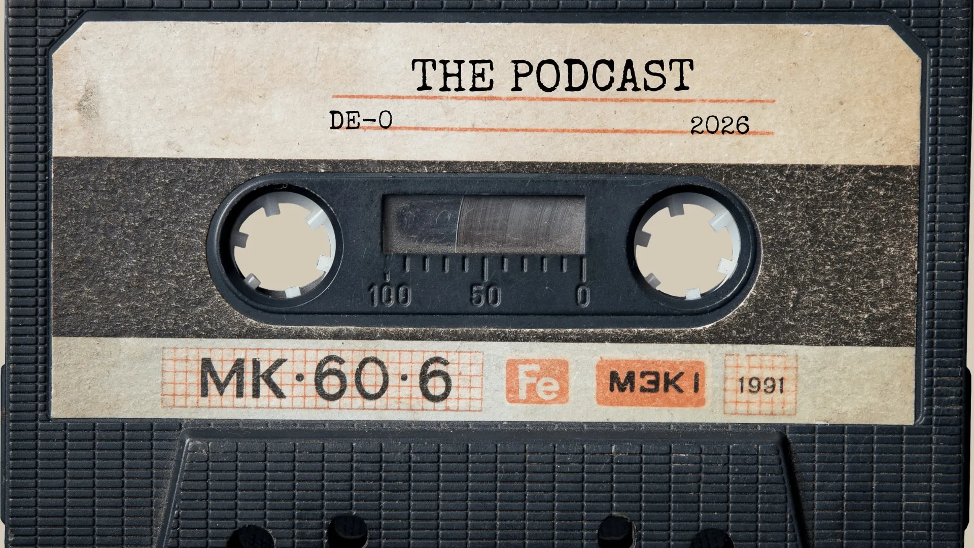 The podcast's cover: a cassette tape whose label reads The Podcast, DE-0, 2026
